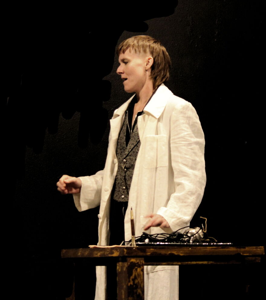 Amber McNew plays the part of frustrated inventor Elisha Gray.