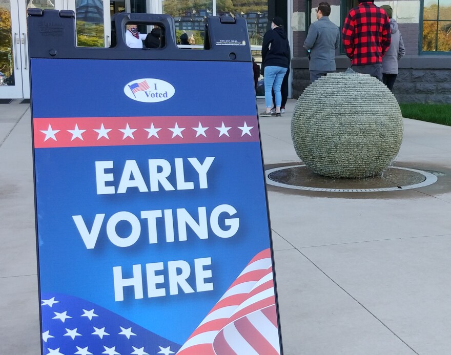 Voters stand in line outside the Kenton County Administration Building, the morning of Monday, Nov. 2, 2020, waiting to vote.