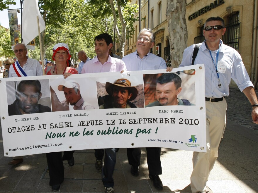 The hostages' families, friends and activists demonstrate in Aix-en-Provence, France, in June.