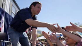 Republican presidential candidate Florida Gov. Ron DeSantis shakes hands with fairgoers after taking part in a Fair-Side Chat with Iowa Gov. Kim Reynolds at the Iowa State Fair, Saturday, Aug. 12, 2023, in Des Moines, Iowa.