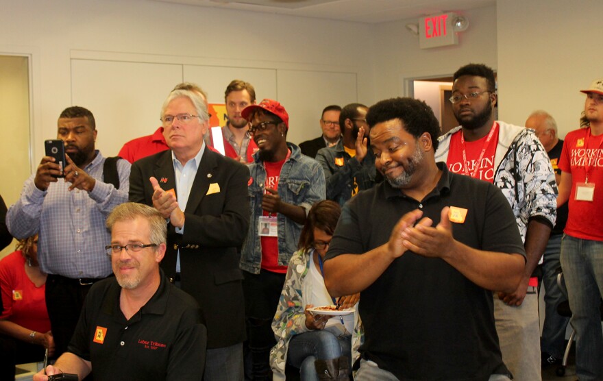 Canvassers, including Missouri AFL-CIO President Mike Louis and Montague Simmons of the Organization for Black Struggle, applaud AFL-CIO Vice President Tefere Gebre on Oct. 15, 2016.