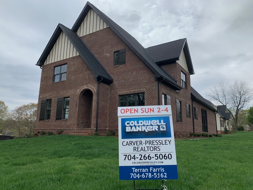 A house with a for-sale sign