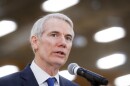 In this April 16, 2018 file photo, Sen. Rob Portman, R-Ohio, speaks during a news conference at a Kroger supermarket as the company announces new associate benefits attributed to the Tax Cuts and Jobs Act, in Cincinnati.