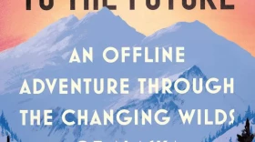 The cover of North to the Future features a tall mountain in the background, with spruce trees in the foreground.
