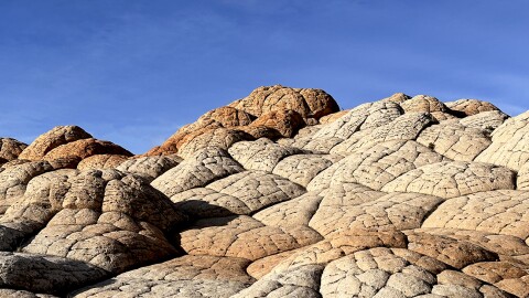 Navajo sandstone rockscapes along the Arizona-Utah border take on otherworldly yet familiar shapes, tempting visitors to bestow names upon the wind-carved formations.