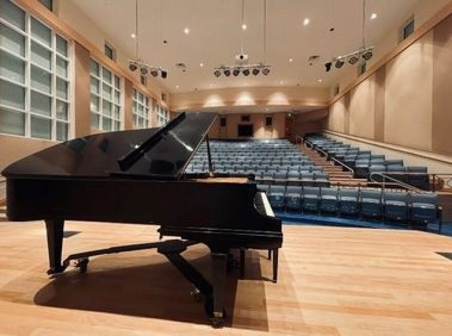 Photo of Gulf Theater with piano and stage in foreground.
