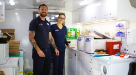 Representatives from the Global Alzheimer’s Platform Foundation prepare the mobile unit for cognitive assessments and blood testing on Friday, Sept. 25, 2026. (Catherine Chapman/WUFT News)