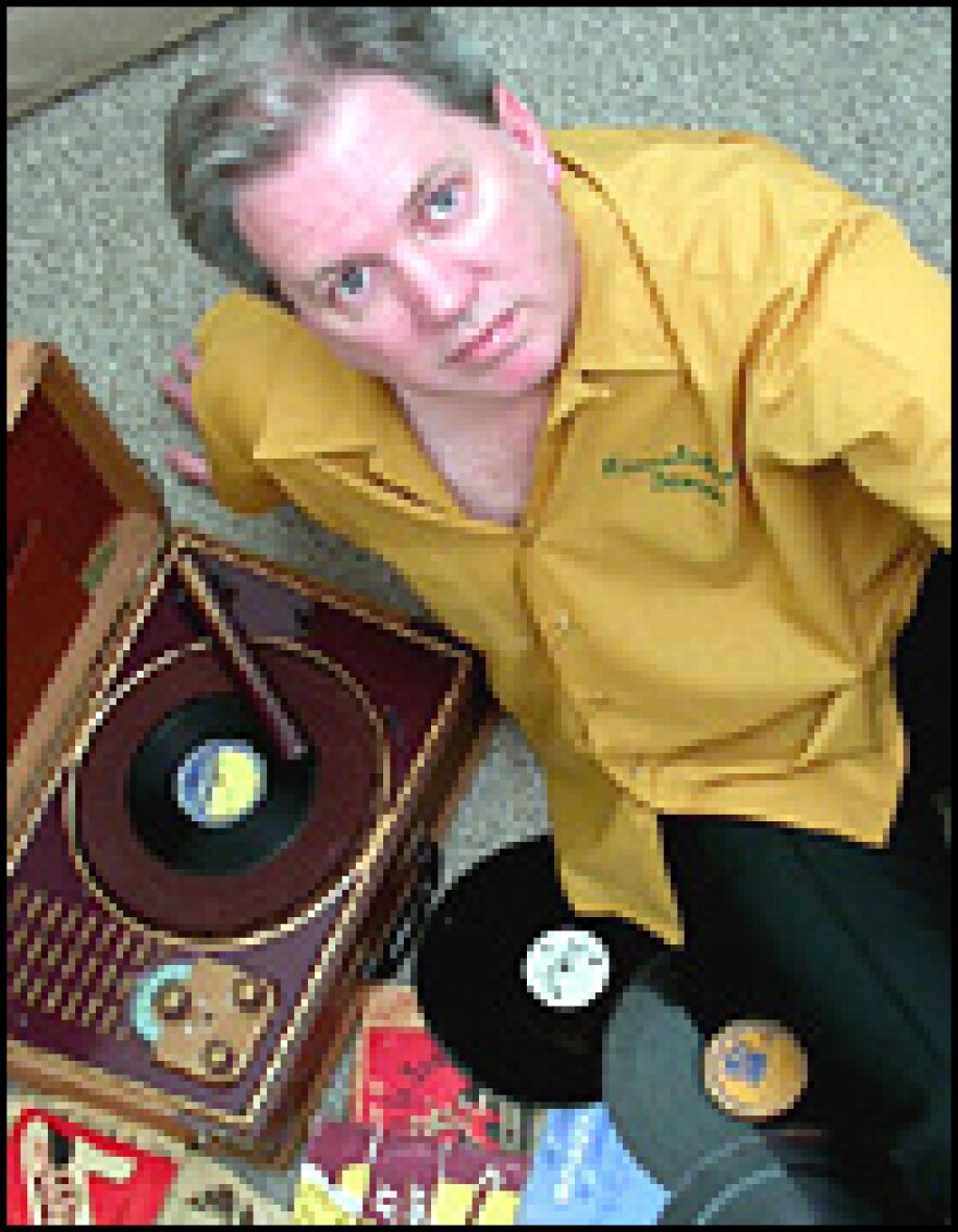 Phil Nohl with some albums from his collection.