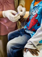 A child is tested for HIV in Johannesburg, South Africa. A single injection of antibodies that target HIV is being developed and analyzed.