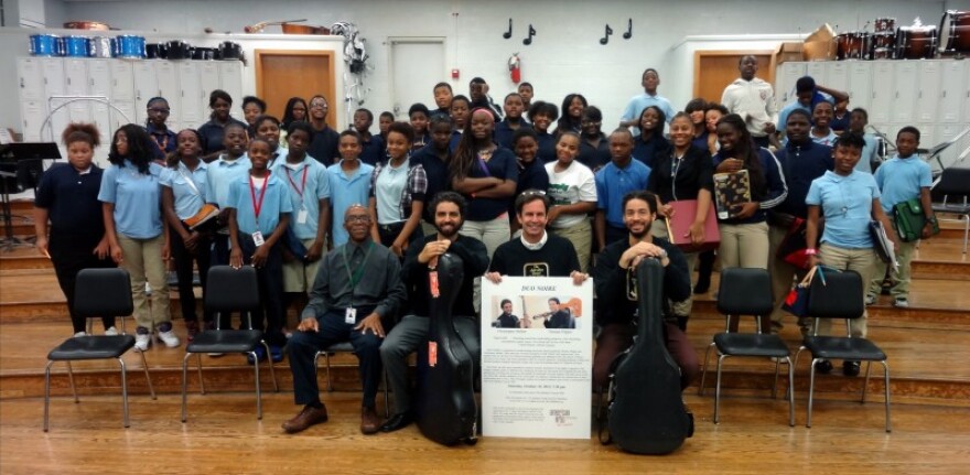 Guitar duo Noire, guitarists Thomas Flippin and Chris Mallett, visited Normandy Middle School in 2014. Normandy Middle School and Normandy High School have guitar programs; instruments and supplies were provided by the St. Louis Guitar Society and Beyond 