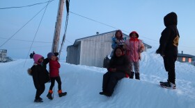 Kids play in Newtok’s fading daylight. Decades of melting permafrost and severe erosion along the banks for Ninglick River are rendering their community increasingly unlivable.