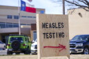 FILE - A sign is displayed outside the Seminole Hospital District offering measles testing, Feb. 21, 2025, in Seminole, Texas.