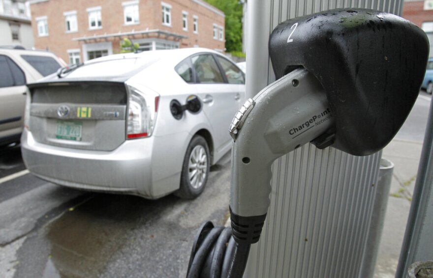 An electric charging station is seen on Tuesday, June 18, 2013 in Montpelier, Vt. Vermont Gov. Peter Shumlin and Quebec Premier Pauline Marois say they're implementing an electric vehicle charging corridor across the international boundary between the state and province. The corridor will initially link Burlington and Montreal with more than 20 charging stations along the 138-mile route.(AP Photo/Toby Talbot)