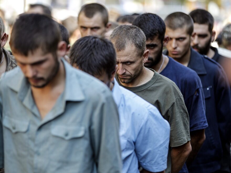 Ukrainian army prisoners of war are marched through  rebel-held Donetsk, Ukraine, in a counter-move to a parade in Kiev to mark the country's independence day.