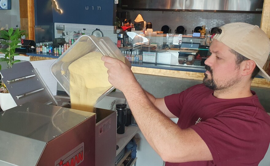 Humble Oven owner Mason fills the pasta machine with 100% Durum Semolina, which he has found is the best flour for his product.