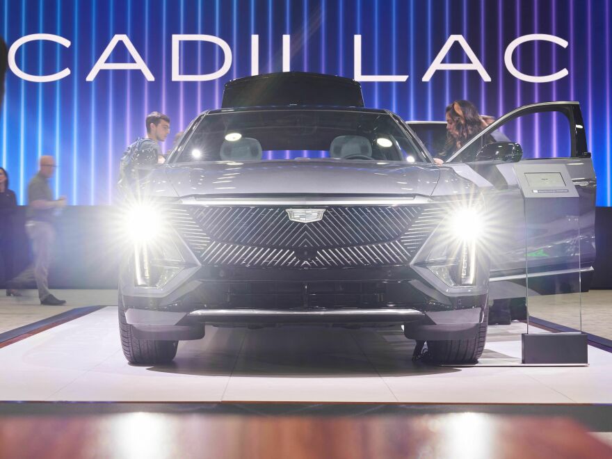 People look at the Cadillac Lyriq at the North American International Auto Show in Detroit on Sept. 14, 2022. The electric car will still qualify for the full tax credit under the latest IRS guidelines.