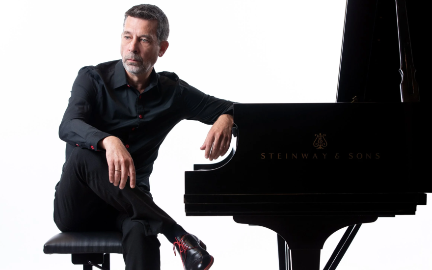 Photo of Sergei Kvitko sitting at a piano