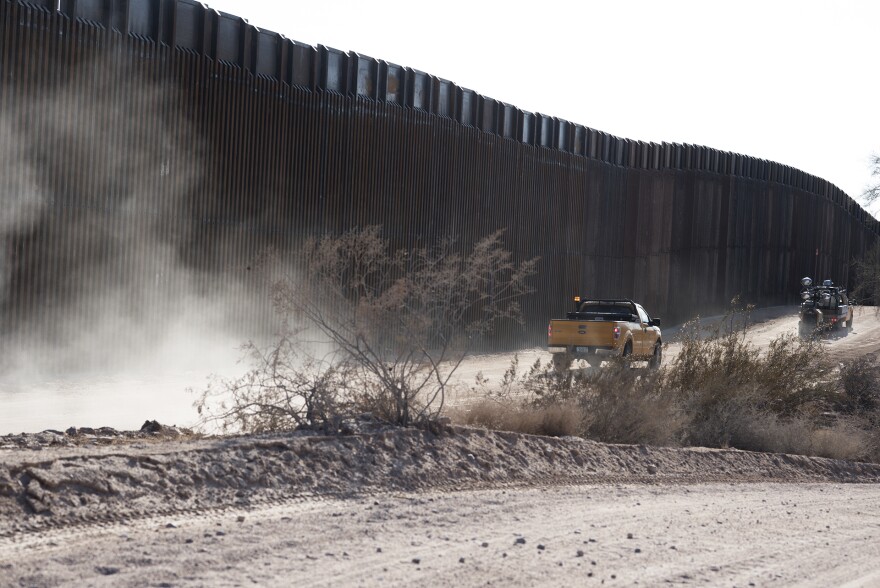 A Kiewit Corporation truck drives along an access road along the border wall east of Quitobaquito Springs at Organ Pipe Cactus National Monument on July 18, 2020.