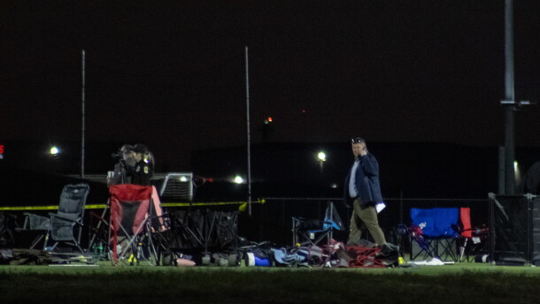 Investigators look over the scene at Stryker Sports Complex on Saturday after a truck drove onto the soccer field, killing two people.