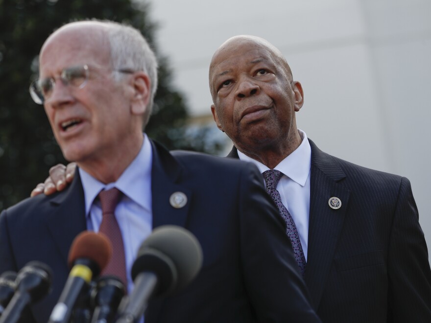 Rep. Elijah Cummings, D-Md., listens as Rep. Peter Welch, D-Vt., speaks to members of the media Wednesday outside the West Wing of the White House in Washington following their meeting with President Trump.