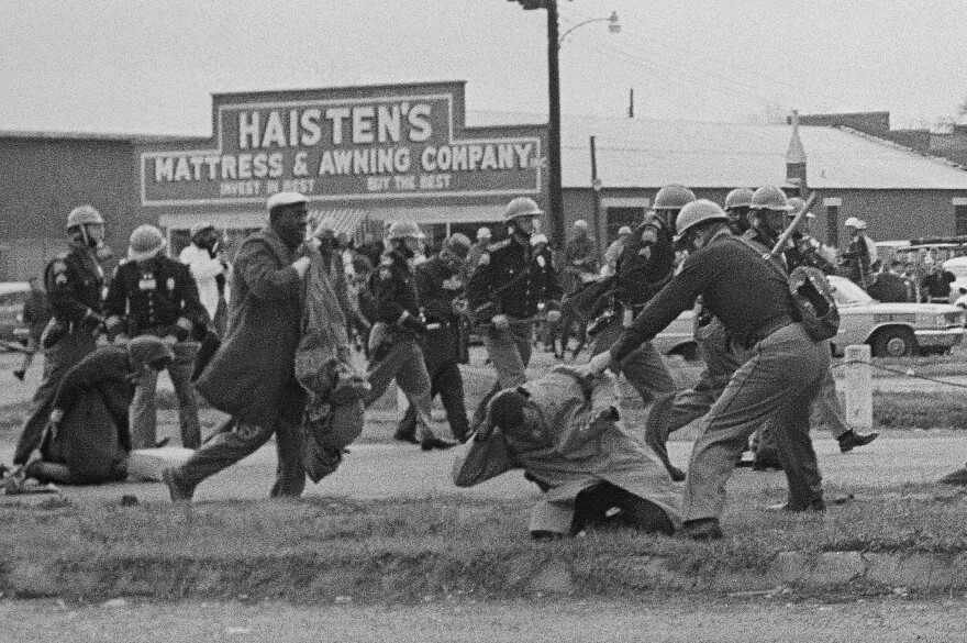 State troopers hit protesters with billy clubs to break up a civil rights voting march in Selma, Ala., on Sunday, March 7, 1965.