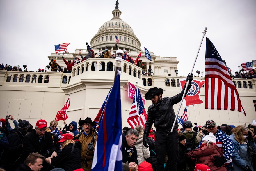 WASHINGTON, DC - JANUARY 06: Pro-Trump supporters storm the U.S. Capitol following a rally with President Donald Trump on January 6, 2021 in Washington, DC. Trump supporters gathered in the nation's capital today to protest the ratification of President-elect Joe Biden's Electoral College victory over President Trump in the 2020 election. (Photo by Samuel Corum/Getty Images)