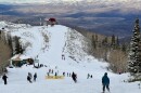 Skiers and riders travel down upper Homerun from Bonanza Express after it opened Dec. 20, 2025.