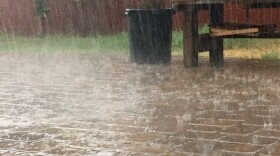 Rain falls on backyard pavers in central Phoenix.