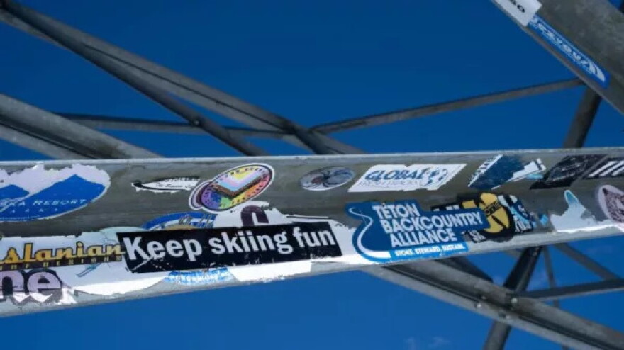  Stickers cover the green billboard that’s planted on Mount Glory.