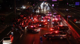 Demonstrators march down Interstate 490 West toward the city after confronting police at the RPD station at Child and Campbell streets. Hundreds of protesters marched after the grand jury decision on Daniel Prude's death.