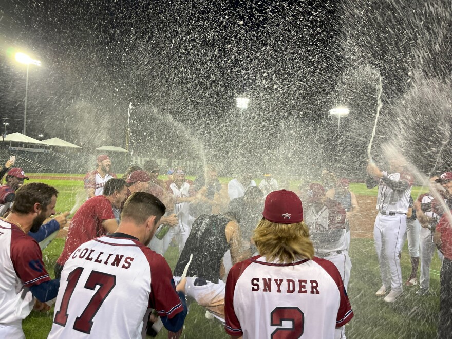 The Monarchs celebrate on-field after beating the Sioux City Explorers in the American Association's West Division Championship Series. The win secured the Monarchs' spot in the Wolff Cup Finals series.