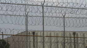 A razor wire fence surrounds the Joseph A. Harp Correctional Center in Lexington.