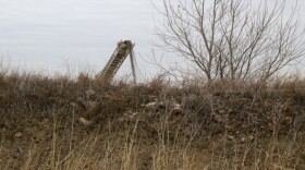 Washed limestone tumbles into railcars behind this artificial berm near Mill Creek, Okla. 