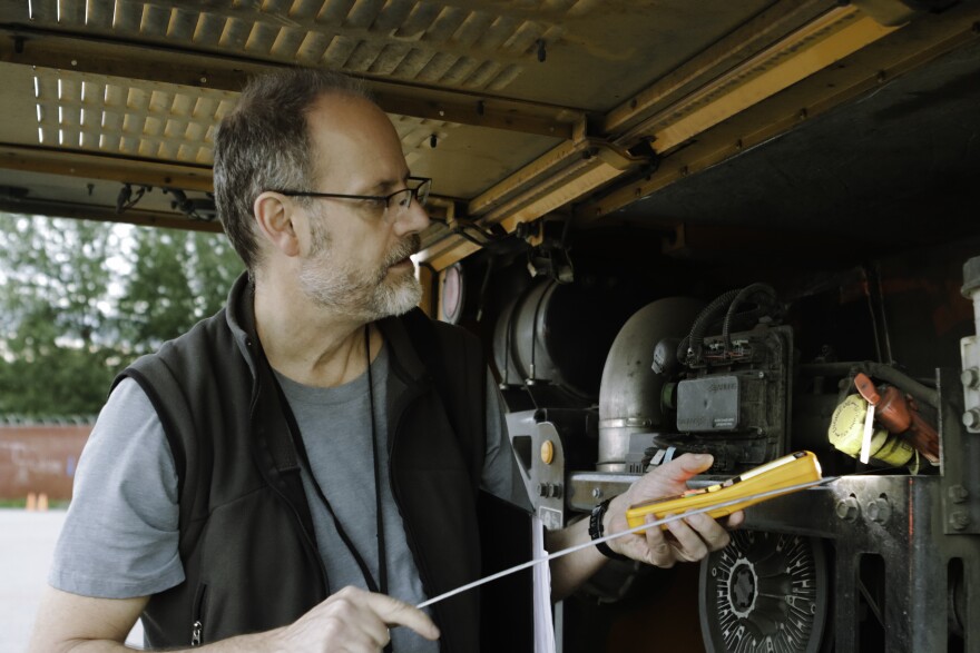 man makes sure engines good