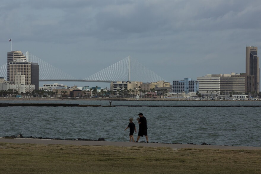 People stroll through Cole Park near downtown Corpus Christi on Oct. 25.