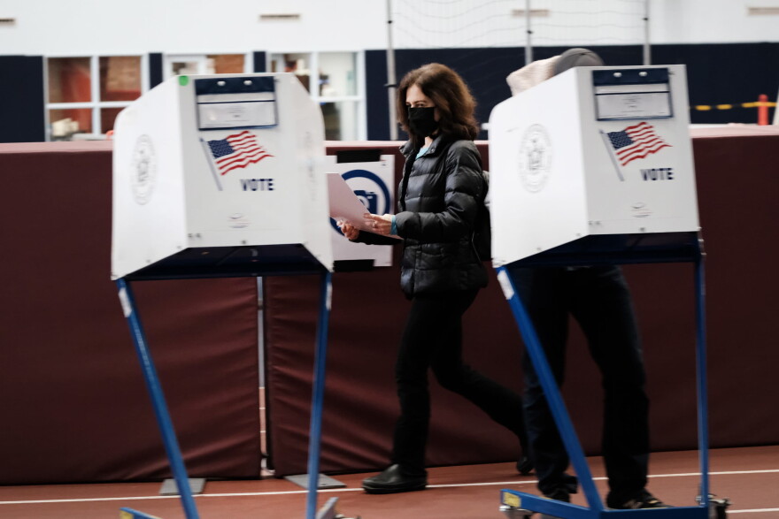 NEW YORK, NEW YORK - NOVEMBER 02: People visit a voting site at a YMCA on Election Day, November 02, 2021 in the Brooklyn borough of New York City. Over 30,000 New Yorkers have already cast their ballots in early voting for a series of races including the race for mayor in which Democrat Eric Adams is running against Republican and Curtis Sliwa. (Photo by Spencer Platt/Getty Images)