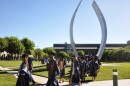 Smiling graduates from UC Merced’s Class of 2024 enter the commencement ceremony at the campus in Merced, Calif on May 11, 2024.