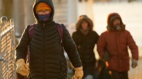 Island commuters are bundled against the cold as they disembark from a ferry on a 1-degree F. morning, Saturday, Jan. 24, 2026, in Portland, Maine.