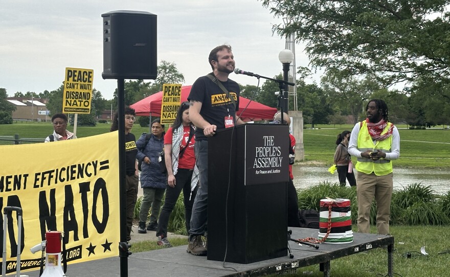 image of man talking at podium.