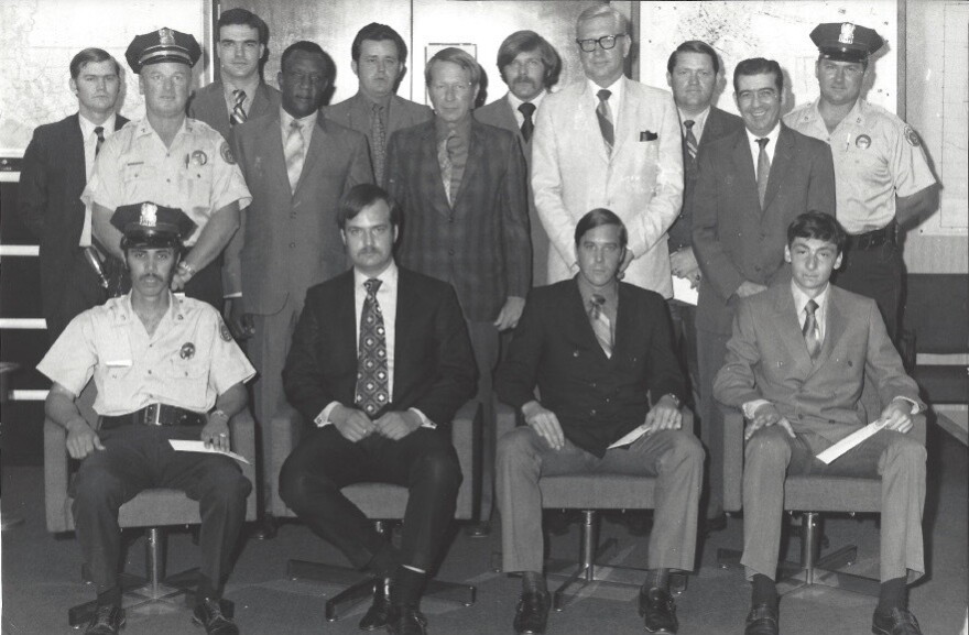 Sgt. Perry White, left, stands among NOPD officers receiving reward checks in 1971. White is pictured in the second row, second from left.