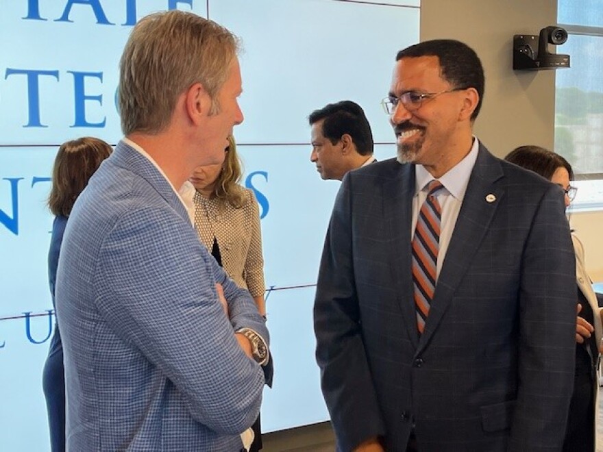 SUNY Chancellor John King, right chats after the announcement July 15, 2024.