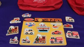 This sound puzzle sensory toy allows children to place each vehicle in its corresponding place. The puzzle will play interactive sounds of each vehicle when placed in the correct spot. (Christine Guerrero/WUFT News)