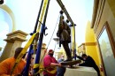 This Monday, Dec. 21, 2020 photo provided by the Office of the Governor of Virginia shows workers removing a statue of Confederate Gen. Robert E. Lee from the National Statuary Hall Collection in Washington.