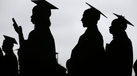 Graduates line up before the start of commencement. (Seth Wenig/AP)