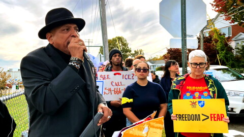 Rev. Scott Marks stands outside Tweed-New Haven Airport on the afternoon of October 21, 2026 with members of the New Haven Immigrant Coalition and other pro-immigrant advocates. He is the director of the social justice community group New Haven Rising and a pastor of New Growth Praise Center Church of God in Christ. "We are here to say clearly: no agency is above the rule of law," Marks said, "and no agent walks through these doors without accountability."