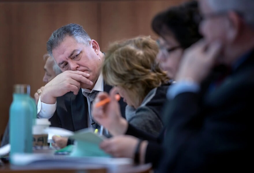 State Rep. Brian Baca, R-Los Lunas, left, listens to committee discussion during a February 2023 meeting of the House Appropriations and Finance Committee at the state Capitol. A recent special audit found Baca was improperly paid while taking time off from his job as a Los Lunas Schools administrator.