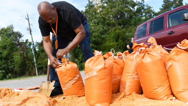 Residents pick up sandbags for storm preparation at the James Seals Jr. Parks & Recreation Center ahead of Hurricane Isaias' expected landfall along the Gulf Coast, Thursday, Oct. 8, 2026, in Mobile, Ala. (AP Photo/Octavio Jones)