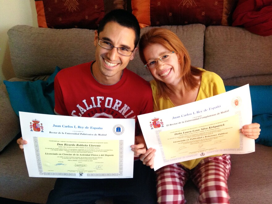 Ricardo Robleño Llorente and his wife, Laura Silva Kirkpatrick, show their college degrees at home in Madrid. Even though they have two bachelor's degrees and a master's between them, they were unable to find permanent work through most of their 20s, during Spain's economic crisis. "Why bother going to college at all?" Silva Kirkpatrick asks.