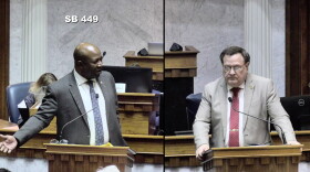 Sen. Greg Taylor (D-Indianapolis), left and Sen. Mike Young (R-Indianapolis) debate the juvenile sentencing bill on the Senate floor.