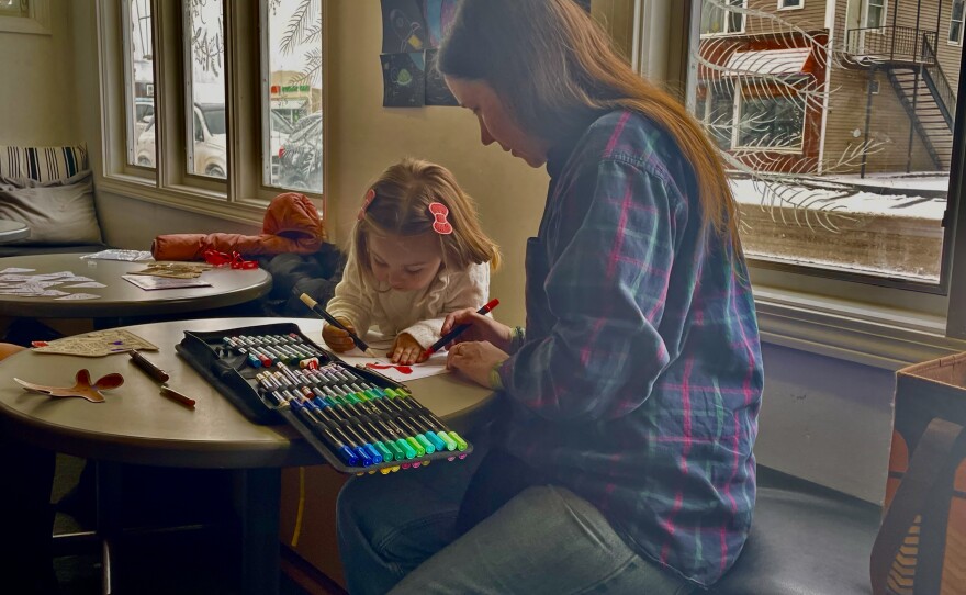 Three-year-old Trinity with Jenna Jandreau at Rivertown Community Arts Center in Fort Kent, coloring together. Jandreau is the founder of Rivertown, which opened in September, 2024.